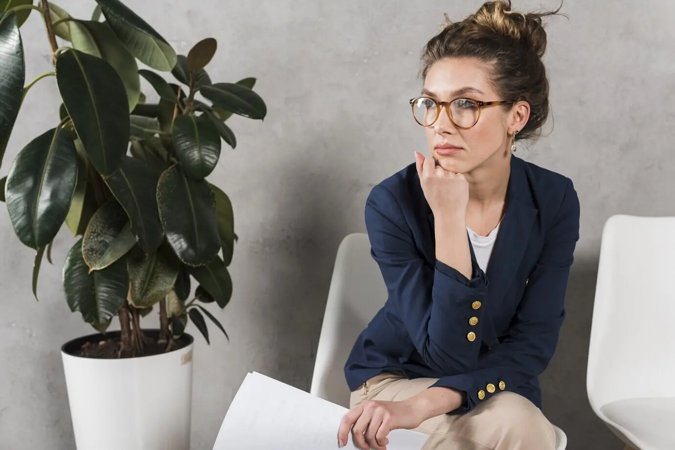 A woman patiently awaits her job interview.